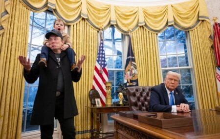 Tesla and SpaceX CEO Elon Muskwith his son X-A-Xii join Donald Trump as he signs executive orders in the Oval Office of the White House