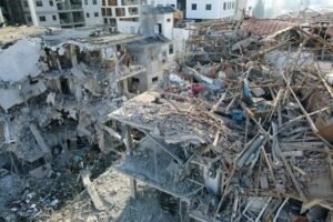 Damaged buildings at a site hit by a missile fired from Iran in the Israeli city of Ramat Gan (Picture: AFP)