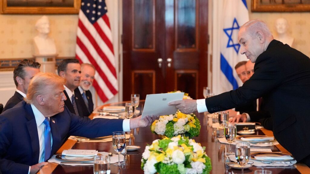 "Benjamin Netanyahu presented Donald Trump with a letter nominating him for the Nobel Peace Prize (Image: AP)."